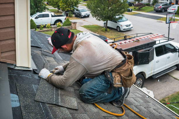 Professional Storm Damage Roof Repair technician working in Hamden, CT